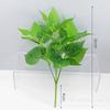 En stock pared de planta artificial decoración de pared de fondo de boda accesorios de planta verde hoja de plástico haz de 7 cabezas rábano verde Perenne