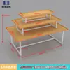 Expositor Promocional Papelería Isla para Madre y Bebé Apilador Gabinete de Exhibición de Cosméticos de Alta Calidad Mesa Flujo de Tres Niveles Estantería de Acero y Madera
