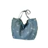 Nova bolsa de lona jeans estilosa para mulheres com laço, bolsa tote doce e versátil, bolsa de ombro casual de grande capacidade