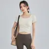 2026 Nuevo Estilo Yoga Fitness Top de Aspecto Elegante Adelgazante con Almohadillas en el Pecho Ropa de Pilates Fitness Manga Corta Ropa de Yoga para Mujer