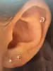 Pendientes de Mini Estrella de Mar y Mariposa con Baño de Oro Real de Latón Caliente Transfronterizos Europeos y Americanos para Mujer Pendientes de Lujo Ligero de Nicho
