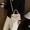 Nuevo bolso de mano de lujo de nicho para comercio exterior 2026 para mujer, bolso Kelly retro con estampado de piedra, bolso de hombro cruzado versátil para otoño