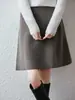 Falda corta de punto de lana pura estilo A para otoño e invierno, de cintura alta, con una caída favorecedora, efecto adelgazante, adecuada para ir al trabajo, diseño simple, e ideal para figuras petite.