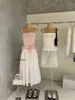 Wgwe9019 Guangzhou Shisanxing Moda Feminina Verão Novo Estilo Patchwork Laço Doce Camisola Top Emagrecedor Tendência