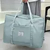 Nueva bolsa de almacenamiento para maternidad de gran capacidad para guardar edredones, conveniente para viajar, se puede acoplar a una maleta de ruedas para viajes de negocios y de placer.