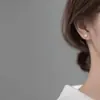 Aretes de Clip Cruzados de Perla Brillante para Mujer Sin Perforaciones, Brazaletes para Orejas de Diseño Nicho, Nuevos Pendientes de Lujo 2026