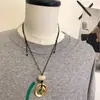 Collar Largo con Colgante de Agujero de Viento Escarchado para Mujer Nuevo Estilo Chino Diseño de Lujo Ligero Cadena de Suéter Deslizante de Gama Alta de Nicho