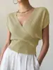 Suéter de tricô liso bestseller transfronteiriço feminino com design de gola cruzada, estilo versátil que afina a cintura, valoriza a silhueta, adequado para o trabalho e para o dia a dia.
