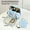 Bolso de maquillaje nuevo 2026 color azul claro, gran capacidad, impermeable, con compartimentos y capas, una bolsa de almacenamiento lujosa y portátil