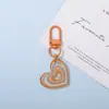 Nuevo llavero colgante con forma de corazón de acrílico transfronterizo, decoración de bolso para chicas, regalo, accesorio para llavero de coche