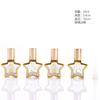Botella de perfume dorada con forma de estrella, botella de aceite galvanizada, bola, botella pulverizadora portátil, botella vacía para cosméticos, venta al por mayor