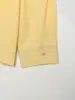 2026 Novo Produto da Moda Estilo Europeu e Americano: Camisa Casual de Cor Sólida com Gola Reversível Versátil e Detalhe de Botões