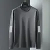 Camiseta casual versátil de manga larga para hombre para otoño, cuello redondo, color liso moderno, cómoda, transpirable y de corte holgado.
