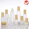 Botella de loción de esencia esmerilada con cubierta de veta de madera, subbotella cosmética de 20-120 ml, botella vacía portátil de vidrio engrosado