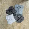 Cárdigan de punto de manga larga con cuello alto a rayas de estilo retro europeo y americano transfronterizo, diseño versátil, suéter holgado para mujer