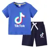 Camiseta infantil 2022 TikTok verano nueva ropa infantil de comercio exterior coreana pantalones cortos de manga corta para niños traje de dos piezas
