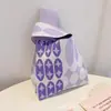 Suministrado directamente por el fabricante, bolsos de punto con dibujos animados peculiares, bolsos de mano de punto nuevos, bolsos lindos, bolsas de regalo de Año Nuevo
