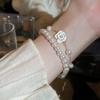 Juego de 2 pulseras de camelia con goteo de aceite dulce y perla de imitación, chapado en oro real, temperamento de alta gama, adornos de mano ajustables para mujer