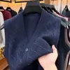 Chaleco cárdigan de punto jacquard transfronterizo para otoño e invierno, un suéter sin mangas cálido, casual y versátil con cuello en V, adecuado para personas de mediana edad y mayores