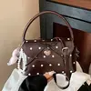 Bolso cuadrado pequeño de lunares dulces de nicho transfronterizo 2026 nuevo bolso de hombro para axila con lazo de moda versátil bolso cruzado