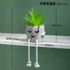 Sencilla creativa muñeca de pies colgantes cilindro de cemento simulación planta suculenta maceta sala de estar decoración del hogar fabricantes mayoreo