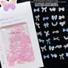 Nuevo Estilo Uñas Postizas Adornos de Resina Plateada con Moño al por Mayor Uñas Portátiles con Moños 3D Mixtos Iridiscentes