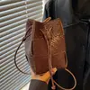 Bolsa tejida con cordón versátil de moda otoño 2026 transfronteriza, diseño de nicho, bolsa tipo cubo, bolso de hombro cruzado