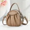 Nova Bolsa para Celular Mini Bolsa de Mão Estilo Ocidental de Alta Qualidade Moda Ins Textura Versátil Bolsa Transversal Pequena Redonda para Mulheres