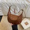 Bolsa Sela Vintage para Mulheres, Nova Bolsa Versátil em Forma de Meia-Lua Outono/Inverno 2026, Adequada para o Dia a Dia, Bolsa de Mão, Bolsa de Ombro, Bolsa Pequena Transversal