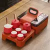 Juego de té de viaje traje pequeño cerámica exterior hogar Kung Fu una tetera cuatro tazas tetera taza portátil regalo creativo
