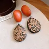 Pendientes de borla con carcasa de madera marrón transfronterizos europeos y americanos, pendientes de estilo vintage Maillard, pendientes de mujer de lujo ligero de alta gama