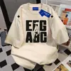 Camiseta Casual Estilo Preguiçoso da Moda com Estampa de Letras de Manga Curta para Mulheres Verão 2025 Novo Estilo Ins Top Solto Casual