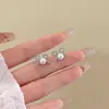 Pendientes de perlas con lazo elegantes de primavera para mujer, pendientes atmosféricos de sentido avanzado, pendientes únicos de lujo y nicho.