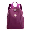 Tendencia transfronteriza bolso de hombro doble mujer 2026 primavera nuevo estilo tela lavada gran capacidad bolsa de viaje mochila casual para mujer