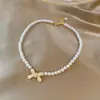 Colar de pérolas moderno para mulheres, design versátil de nicho, corrente para clavícula de luxo leve de alta qualidade com pingente de coração, atacado de joias