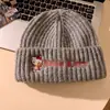 Gorro de punto rosa de Hello Kitty para mujer, lindo gorro de lana bordado de gato, engrosado y cálido con protección para las orejas para el invierno