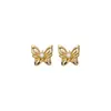 Pendientes de botón de mariposa huecos 3D de aguja plateada Sentido de diseño de nicho Pendientes elegantes Retro Lujo Ligero Sensación de Alta Gama Pendiente para el Trabajo