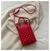 Mini bolso para teléfono móvil con colgante de corazón de lunares de color sólido estilo coreano transfronterizo, bolso de mano de cuero suave, bolso cruzado para niñas