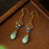 [Tecnología de espejo] Pendientes antiguos de estilo marea nacional con esmalte chapado en oro de imitación de orquídea de jade hetiano.