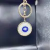 Llavero de flor de amor de aleación nuevo transfronterizo ojo flor cadena de llaves de coche de amor colgante de bolsa de amor