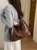 Bolsa de dumplings de gran capacidad para mujer, nuevo diseño de nicho vintage 2026, bolso de hombro cruzado, mochila multifuncional