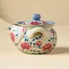 Tetera de cerámica hecha en fábrica con diseños de loto y peonía, juego de té kung fu de alta gama, tetera de mano con separación de té y agua, tetera individual