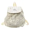 Mochila pequeña para chicas de secundaria, estilo japonés, alto valor estético, diseño de lunares de nicho, mochila ligera de viaje para mujeres