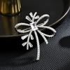 Nuevo Estilo Broche de Lazo Simple Cinta Estilo Chanel Antiluz Corsage de Zirconia Abrigo Accesorios de Alta Gama