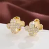 Tendência de moda Erva da sorte popular cobre cravejado zircônia banhado a ouro fivela de orelha de menina fabricantes atacado à vista exclusivo transfronteiriço