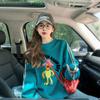 Moletom Fino com Grafite de Desenho Animado Único Super Popular para Mulheres Primavera e Outono 2025 Moda Azul Retrô Blusa Solta que Cobre a Barriga