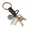 Llavero vintage minimalista de aleación con gesto y cordón de cuero, colgante de metal tejido, accesorio de regalo personalizado para parejas estilo europeo y americano