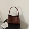 2026 Nova Bolsa de Mão Tecida com Textura em PU Macio, Carteira de Moedas Simples de Cor Sólida Versátil, Bolsa de Mão com Alça de Pulso