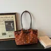 Bolsa Popular de Bolinhas Grande Capacidade Feminina 2026 Nova Versátil para o Dia a Dia Ombro Único Sob o Braço Bolsa Tote Casual de Mão