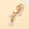 Colgante de Perla con Flor de Cerezo Colorida Estilo Ins Hebilla Metálica en Forma de U Llavero Colgante Pequeño Decorativo Dulce Venta al por Mayor